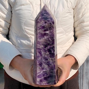 May include: A rustic wooden sign with the text "Welcome to our home" in a handwritten style. The sign features a distressed finish and a simple, inviting design, perfect for a front porch or entryway.