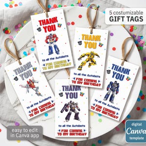 May include: Five customizable gift tags with brown twine. Each tag features a different Transformer character and the words "THANK YOU" in various colors. The tags read "to all the Autobots FOR COMING TO MY BIRTHDAY". The tags are easy to edit in the Canva app.