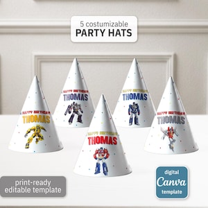 May include: Five white party hats with colorful illustrations of robots, personalized with the name "Thomas" and "Happy Birthday" text. The hats are cone-shaped and decorated with small, colorful polka dots. The image also includes text that says "5 customizable PARTY HATS".