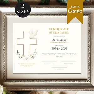 May include: Framed certificate of dedication with a gold cross and dove design. The certificate includes the name "Anna Miller" and the date "30 May 2026". The frame is silver and the certificate has the text "Edit in Canva".