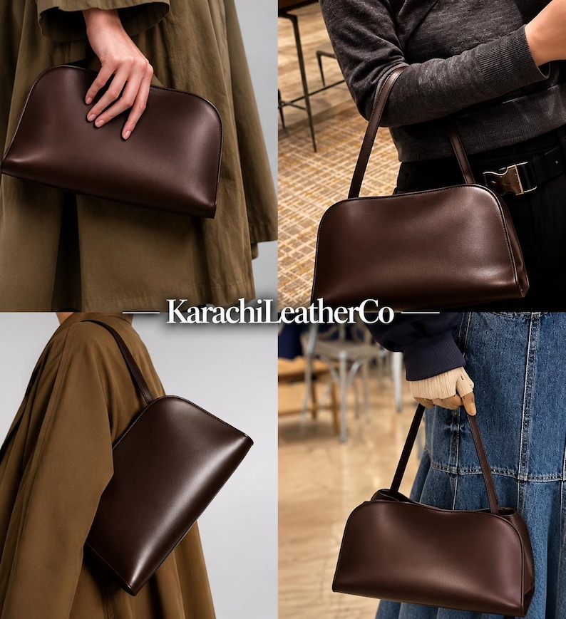 Op de afbeelding: Een donkerbruine handtas met een gladde afwerking, voorzien van een afgerond silhouet aan de bovenkant en een enkele schouderband. De tas is voorzien van de tekst KarachiLeatherCo. Het ontwerp is eenvoudig en gestructureerd met een strakke uitstraling.