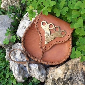 Leather belt bag with brass decoration