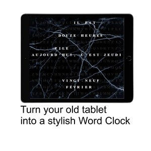 May include: A black tablet displays a word clock with white text on a dark background. The text reads "Douze Heures" and "Aujourd'hui, c'est Jeudi." The caption below says "Turn your old tablet into a stylish Word Clock."