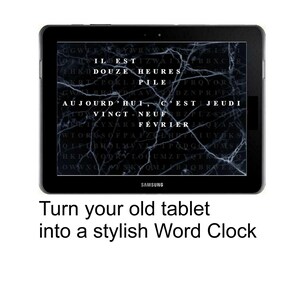 May include: A black Samsung tablet displaying a word clock with a marble-like background. The clock shows the time in French. The text at the bottom reads, "Turn your old tablet into a stylish Word Clock."