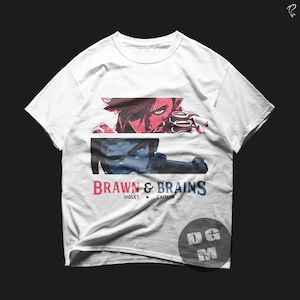 May include: White t-shirt with a graphic of two characters from the video game "League of Legends." The characters are Violet and Caitlyn. The text "Brawn & Brains" is printed below the characters.