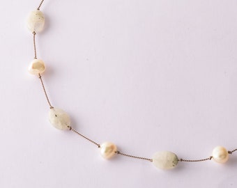 Moonstones and pearls on a string