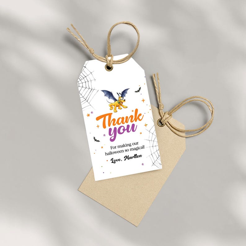 May include: White Halloween-themed gift tag with a cartoon bat and the words "Thank you" in orange and purple. The tag also includes spiderwebs, stars, and the text "For making our halloween so magical! Love, Martten."