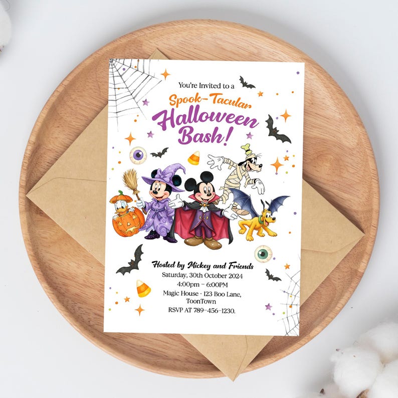 May include: A Halloween party invitation featuring Mickey Mouse and friends in costumes. The invitation includes the text "Spook-Tacular Halloween Bash!" with event details: date, time, and location. The invitation is on a wooden tray with an envelope.