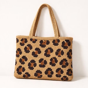 May include: A white ceramic mug with a black handle and the text "But First, Coffee" in a black, handwritten-style font. The mug is on a white surface.