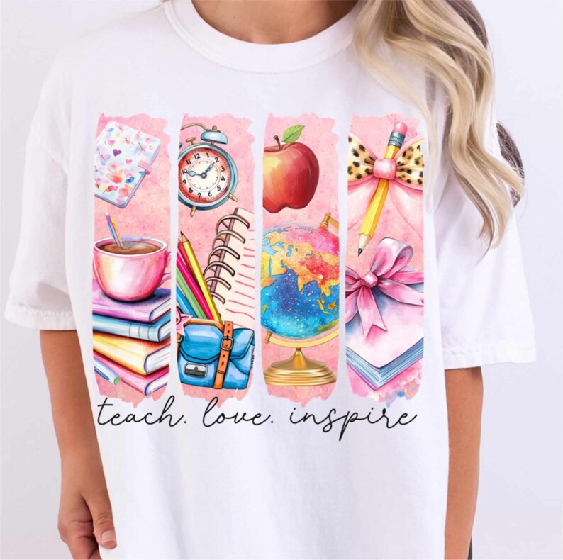 May include: White t-shirt with a pink and white design featuring school supplies, a globe, an apple, and a pencil. The text "teach. love. inspire" is printed below the design.