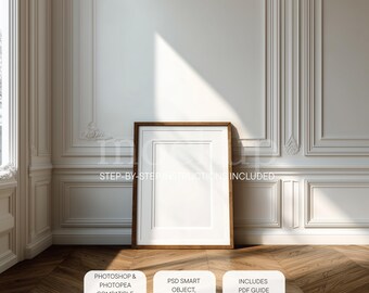 May include: A framed, blank white picture with a brown wooden frame stands on a wooden floor. The frame is centered against a white wall with decorative molding. The image includes the text "STEP-BY-STEP INSTRUCTIONS INCLUDED".