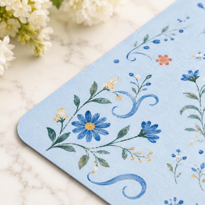 Close up of cute blue tiger artwork on floral mahjong table mat