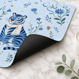 Close up of blue tiger mahjong mat with black non slip neoprene backing