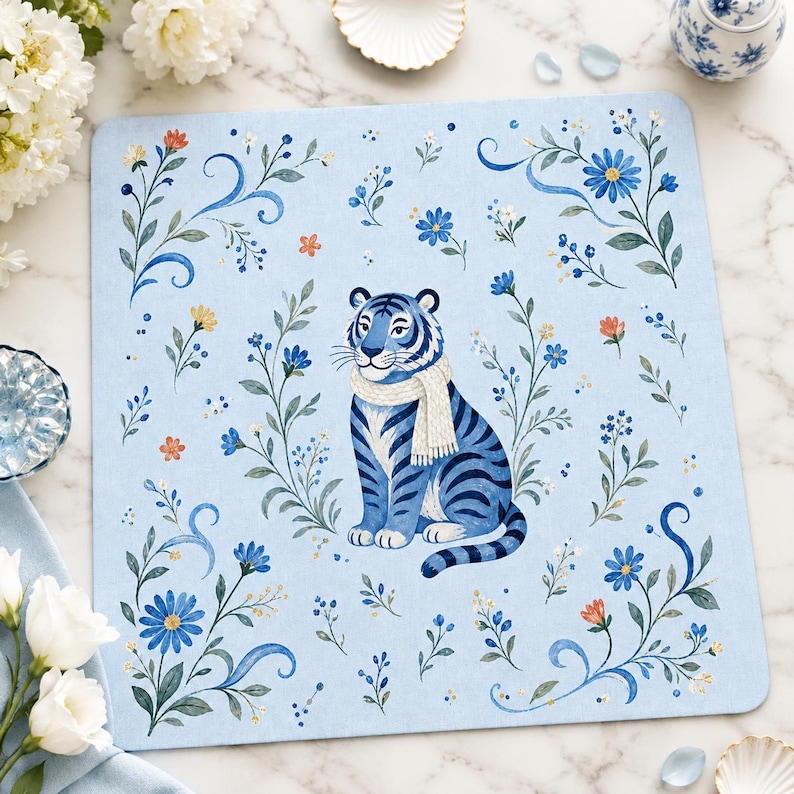 Blue tiger floral mahjong mat on marble tabletop with white flowers