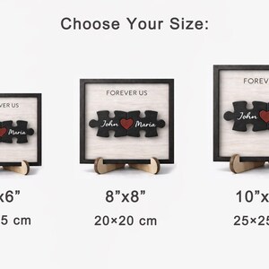 May include: Wooden puzzle art with a black frame and stand. The puzzle pieces spell out "Forever Us" with the names "John" and "Maria" and a red heart. Available in 6"x6", 8"x8", and 10"x10" sizes.