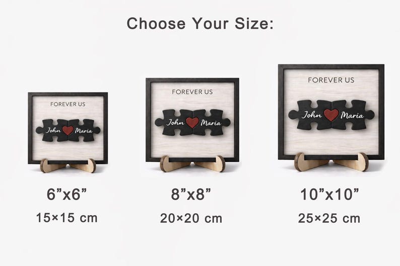 May include: Wooden puzzle art with a black frame and stand. The puzzle pieces spell out "Forever Us" with the names "John" and "Maria" and a red heart. Available in 6"x6", 8"x8", and 10"x10" sizes.