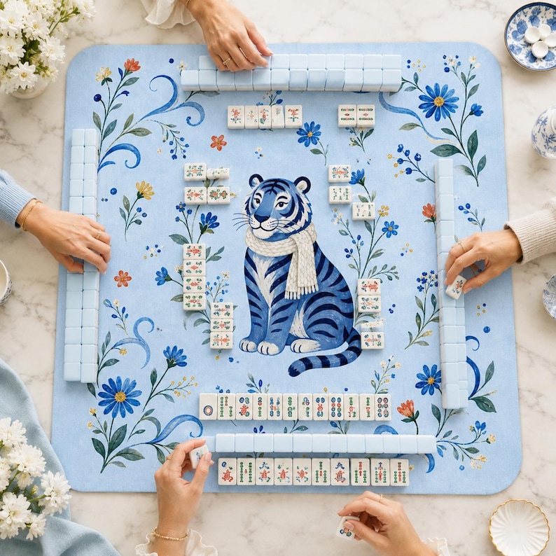 Blue tiger mahjong mat in use with mahjong tiles and players hands
