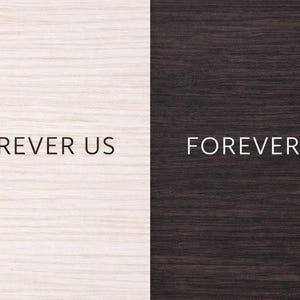May include: Image split vertically, featuring two wooden panels. The left panel is light-colored, while the right is dark. The text "FOREVER US" is centered on both panels in a simple, sans-serif font, creating a contrast between the text and the background.