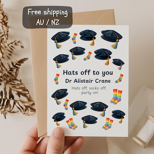 Personalised PhD graduation congratulations card; Funny PhD Graduation Card with Rainbow Socks and Tam Hat, LGBTQ+ Pride Grad Gift Idea