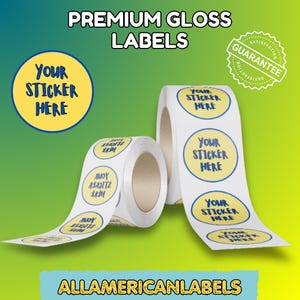 May include: Two rolls of white, round, glossy labels with a blue and yellow design that reads "YOUR STICKER HERE." The image also includes the text "PREMIUM GLOSS LABELS," "GUARANTEE," and "ALLAMERICANLABELS."