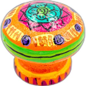May include: A colorful hand-painted ceramic knob with a bright orange base, green and black stripes, and a multi-colored mandala design in the center. The knob is perfect for adding a touch of whimsy to any room.