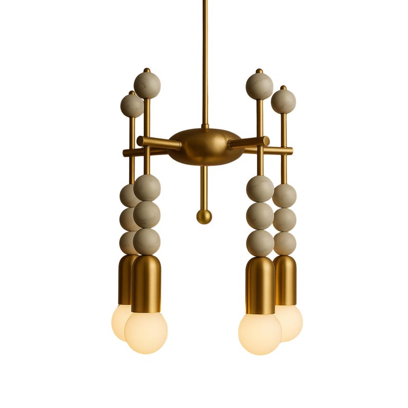 May include: A modern chandelier with a gold-colored frame and decorative elements. The fixture features multiple light bulbs and a design incorporating spherical and cylindrical shapes. The overall aesthetic is contemporary and elegant, suitable for various interior settings.