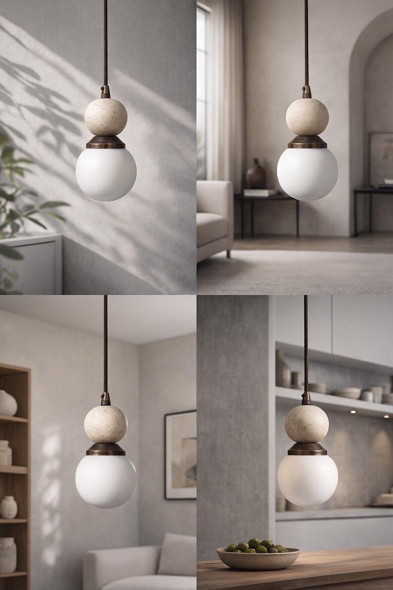 May include: A modern pendant light fixture with a white globe shade and a beige stone sphere above it. The fixture hangs from a dark brown cord. The light fixture is suspended in a room with neutral tones.