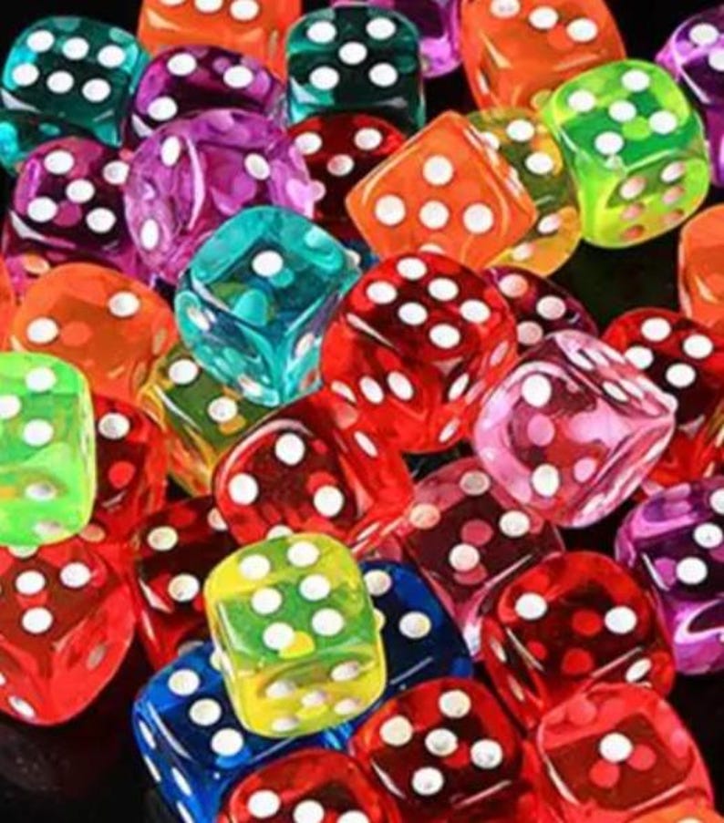 May include: A collection of colorful, transparent dice in various colors including red, green, orange, blue, and purple. Each die has white dots indicating the numbers. The dice are scattered, creating a playful and vibrant image.