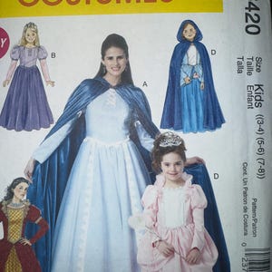 May include: McCall's Costumes pattern M6420 for kids' costumes. The image shows illustrations of various princess-style dresses with capes and a tiara. The pattern includes sizes for children aged 3-8 years old.