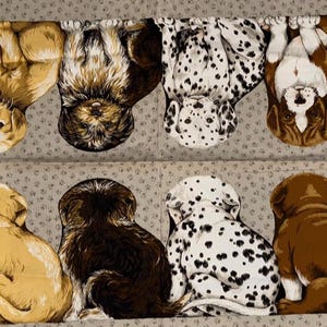 May include: Fabric featuring a repeating pattern of various dog breeds in brown, white, and black. The dogs are depicted in two rows, some upside down, against a light gray background with small, dark gray dots.