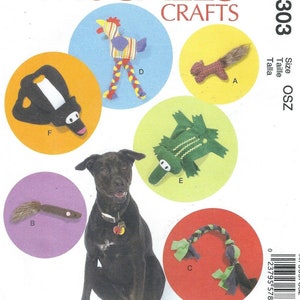May include: A sewing pattern for making dog toys. The pattern includes instructions for making a rooster, squirrel, alligator, and a braided rope toy. The pattern also includes a black and white penguin toy. The pattern is from McCall's Crafts and the pattern number is M7303.