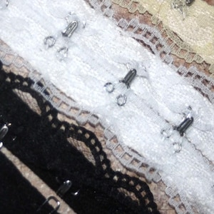 1.25- 2.6 yards Black Cream White Poly lace covered twill tape silver hook and eye BTY 2&quot; wide