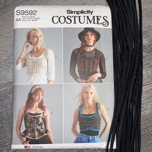 May include: Simplicity Costumes sewing pattern booklet with four different costume designs. The pattern is for sizes 6-12, 32-38 Euro, and 34-40 French. The designs include a white peasant top, a black and red corset top, a gold and black corset top, and a blue and white corset top.