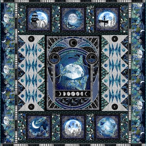 May include: A dark blue and teal quilt featuring a central design of a full moon, butterflies, and trees. The quilt has a repeating pattern of moons, butterflies, and the text "LA LUNA" around the border. The quilt has a geometric design in the center.