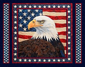 May include: A patriotic quilt featuring an American flag and a detailed image of a bald eagle. The quilt has a dark blue border with star accents and smaller square designs with stars and stripes.