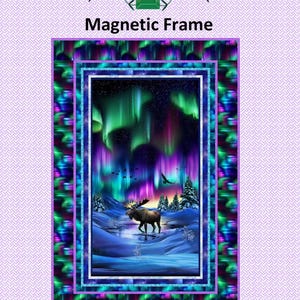 May include: Magnetic frame with a colourful image of the Aurora Borealis above a snowy scene with a moose. The frame measures 96.5 cm x 142.2 cm and is designed by Laureen Smith. The text "Tourmaline & Thyme Quilts" is at the top.