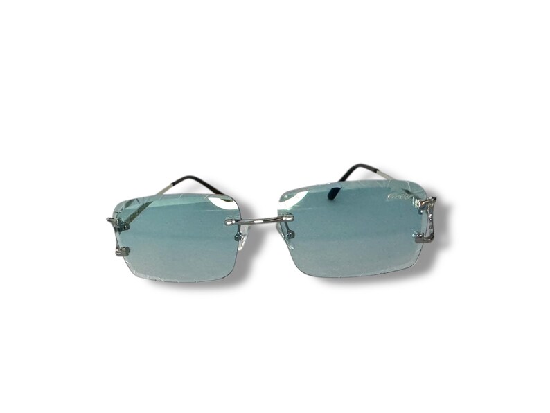May include: Silver frame sunglasses with light blue lenses. The sunglasses have a square shape and a sleek design.