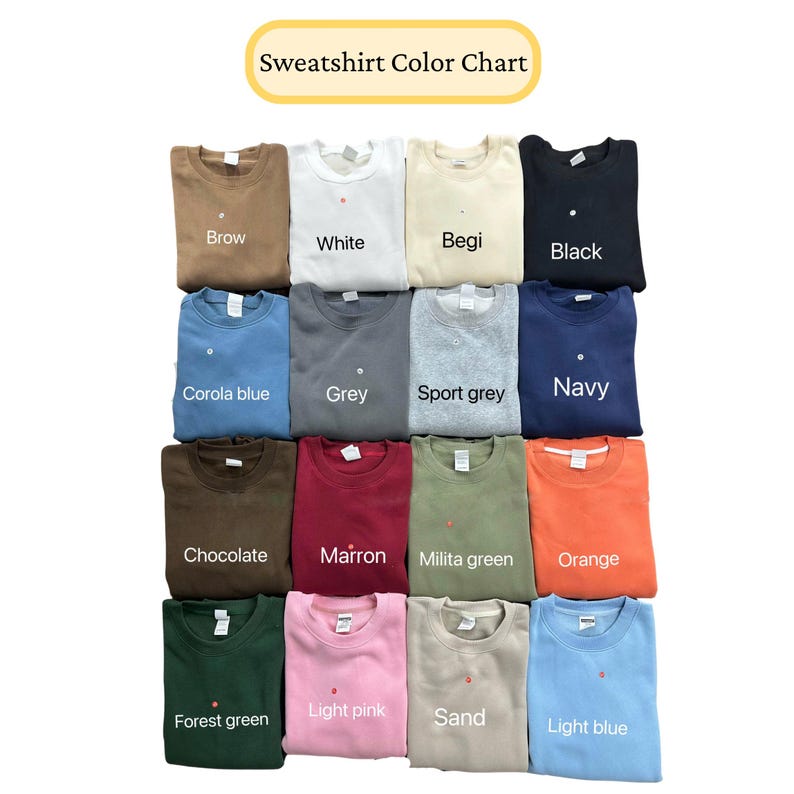 May include: A color chart displaying various sweatshirt colors. The chart includes colors such as brown, white, beige, black, corola blue, grey, sport grey, navy, chocolate, maroon, military green, orange, forest green, light pink, sand, and light blue.
