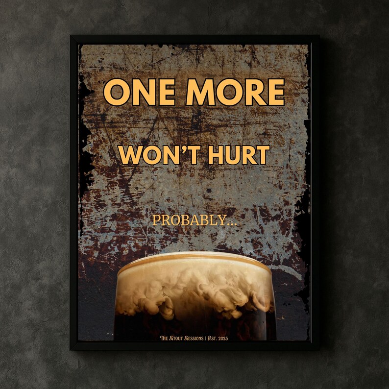 Framed dark humour wall art print reading One More Won’t Hurt Probably displayed in a moody bar style interior with warm lighting, textured vintage background and stout beer imagery, perfect for home bar decor, pub wall art, man cave decoration, kitchen wall humour print and gift for beer lovers seeking bold typography artwork with character and personality