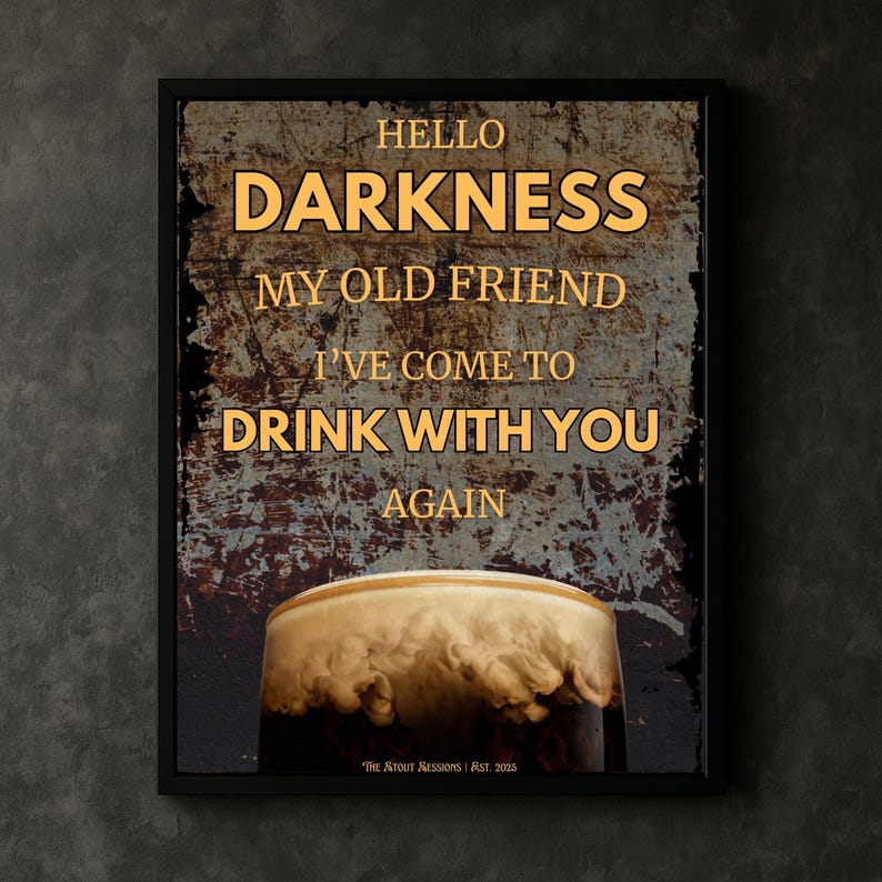 Guinness pint wall art “Hello Darkness” poster mockup leaning on a wooden floor against a neutral wall, rustic tones highlighting the rich foam detail of the pint for a modern home bar or kitchen gallery wall aesthetic.
