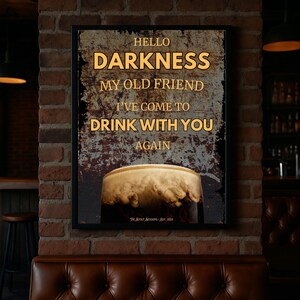 Framed Guinness-inspired wall art poster mockup in a cosy bar corner with a brick wall backdrop and tufted leather seating, creating a rustic pub atmosphere perfect for kitchen or dining room décor inspiration.