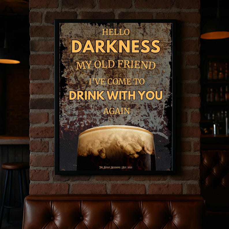 Framed Guinness-inspired wall art poster mockup in a cosy bar corner with a brick wall backdrop and tufted leather seating, creating a rustic pub atmosphere perfect for kitchen or dining room décor inspiration.