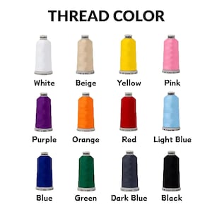 May include: A color chart titled THREAD COLOR displaying twelve spools of embroidery thread in white, beige, yellow, pink, purple, orange, red, light blue, blue, green, dark blue, and black, each labeled with its corresponding color name below.