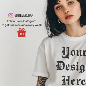 May include: White t-shirt with the text "Your Design Here" in a gothic font. The image also includes the Instagram logo and the text "GOTH.MERCHANT" and "Follow us on Instagram to get free mockups every week". A red gift box with the word "FREE" is also visible.