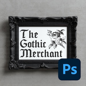 May include: Black framed print with the text "The Gothic Merchant" in gothic font, accompanied by a rose illustration. The frame has ornate detailing. The background is a light gray.