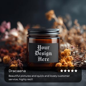 May include: A brown glass jar with a black lid and a black label that reads "Your Design Here" in white gothic font. The jar is surrounded by dried flowers. The text "Dracaena" is below the jar.