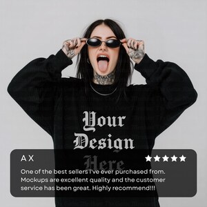 May include: Black sweatshirt with the text "Your Design Here" in a gothic font. The image shows a person wearing the sweatshirt and black sunglasses. The sweatshirt has long sleeves.