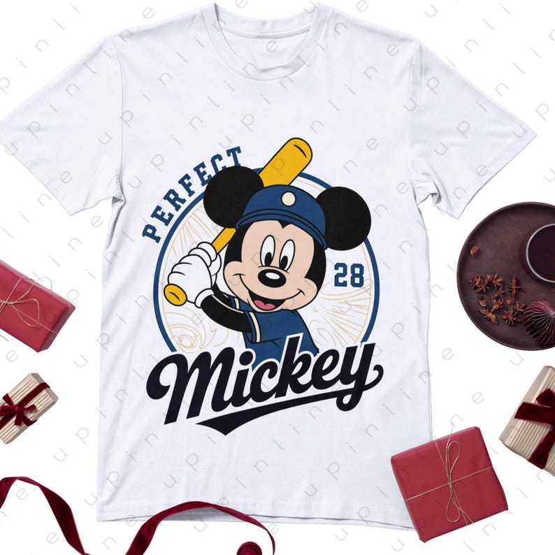 May include: White t-shirt featuring a cartoon Mickey Mouse in a baseball uniform, holding a bat. The design includes the word "PERFECT" above Mickey and "Mickey" below, with the number "28".
