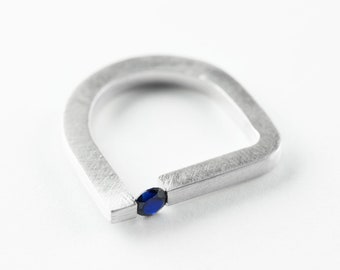 Tension Silver Sapphire Ring with an Off Centred Tension Set