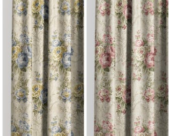 May include: Two floral patterned curtain panels. The left panel features blue and yellow roses with the text "PITCH CORN". The right panel has pink roses with the text "LOVE CHAMPAGNE". Both panels have a beige background.
